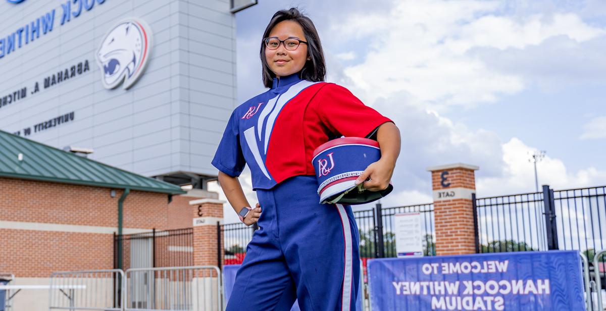 Anita Nguyen, an Honors College freshman, says a lot goes into an on-field marching band routine. The experience is energizing. 