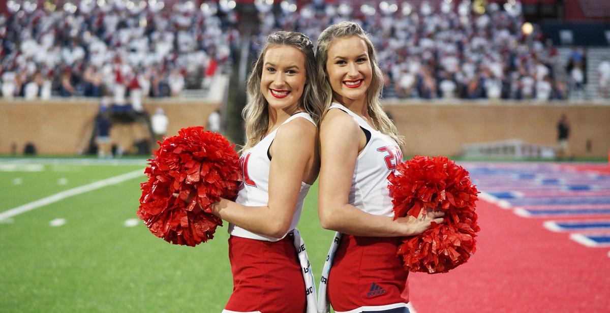 Logan, left, and Mallorie Collins, twin sisters from Satsuma, Alabama, share a residence hall suite, a major in mechanical engineering and a spirit for cheering on the Jaguars.